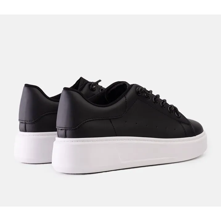 Black sneakers with eye-catching Asmait decoration